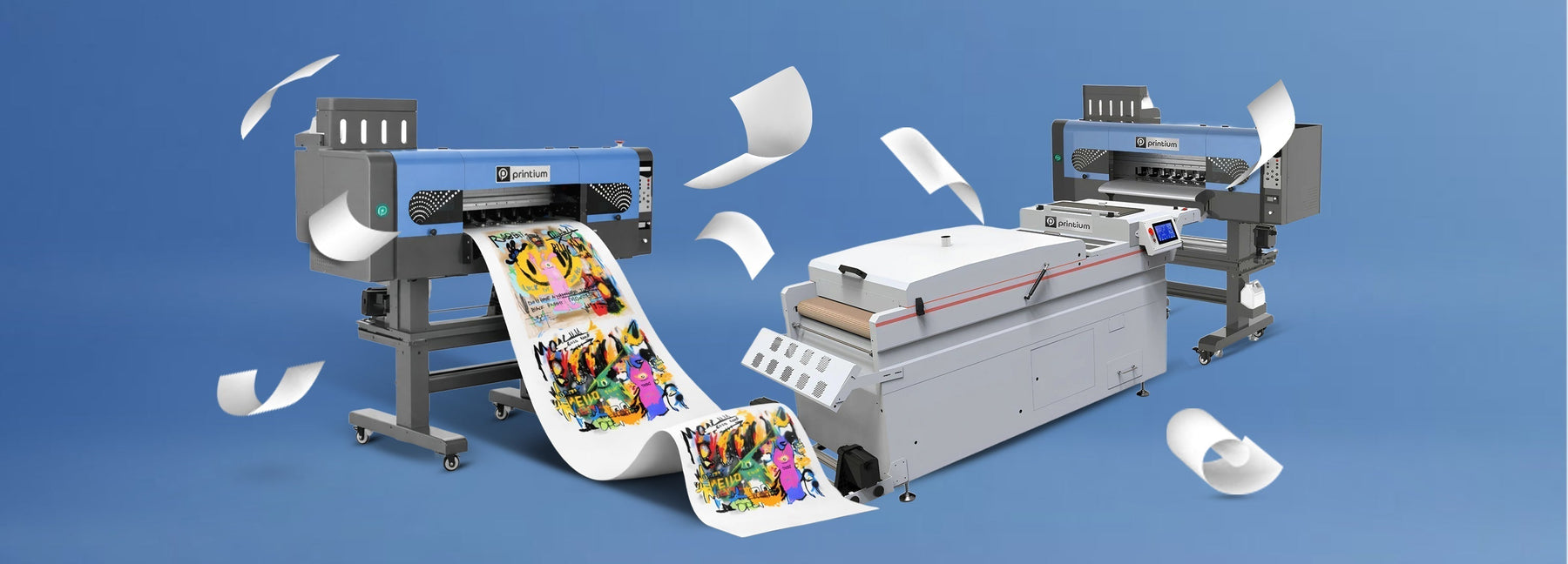 DTF printers and heat press machine with colorful printed film and paper on blue background